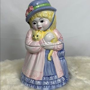 Ceramic cookie jar of girl with a kitten. 12” high